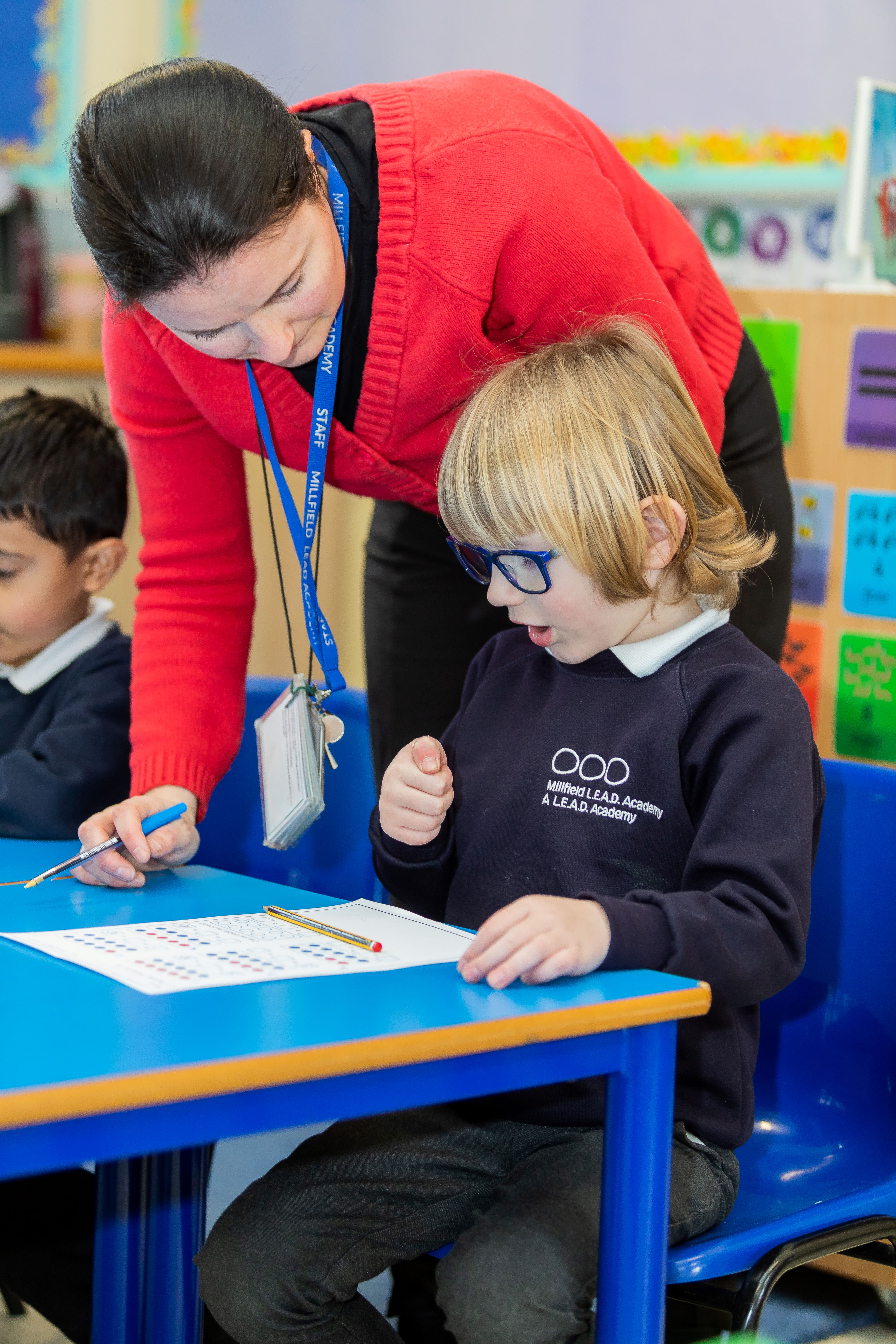 Teacher and pupil at desk KAM_5356